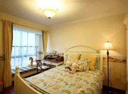 溫情雅致田園風(fēng)格100平米二居室臥室背景墻裝修效果圖